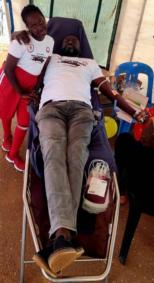 Edmund donating blood at a community blood drive