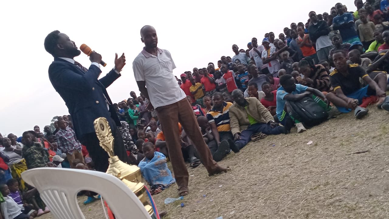 Edmund speaking to a large rally in Kashari South